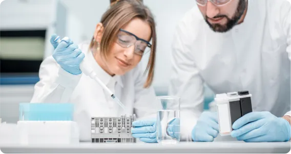Diploma in Biotechnology students conducting laboratory research with scientific equipment